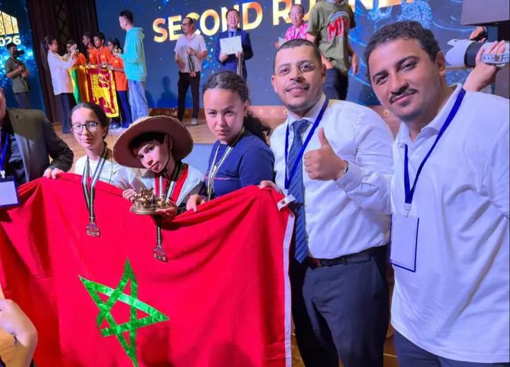 Moroccan team at IMC 2026 in Mongolia with medals and the national flag